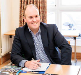 Peter Williams at a desk